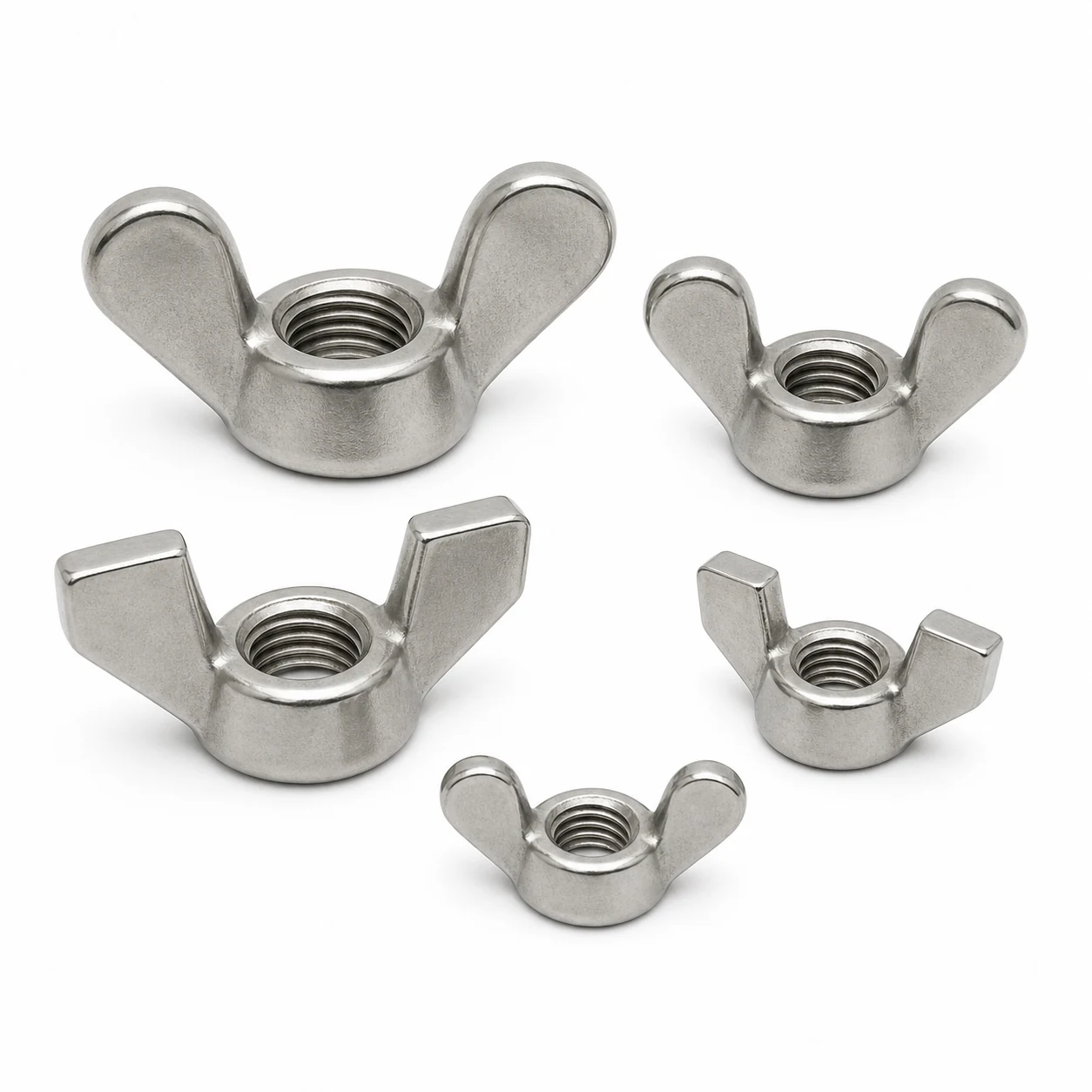 Five stainless steel DIN 315 wing nuts in multiple sizes showing both rounded Type A and angular Type B wing forms on a pure white background