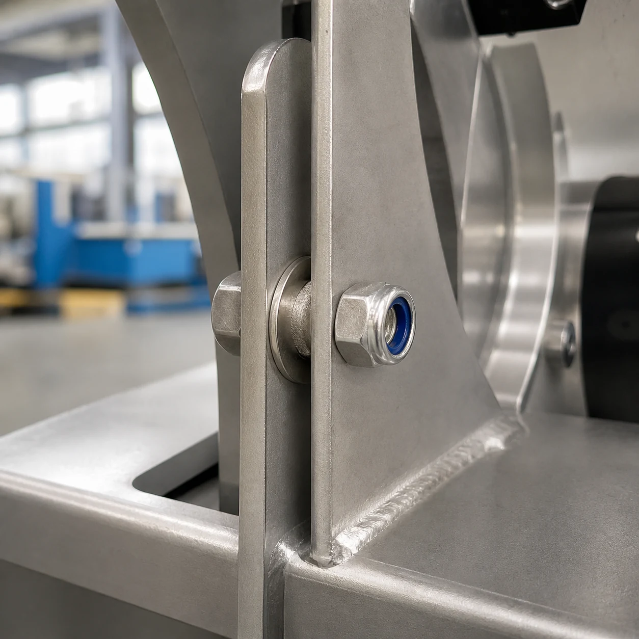Stainless steel nylon lock nut installed with bolt and washer on vibration-prone industrial machinery