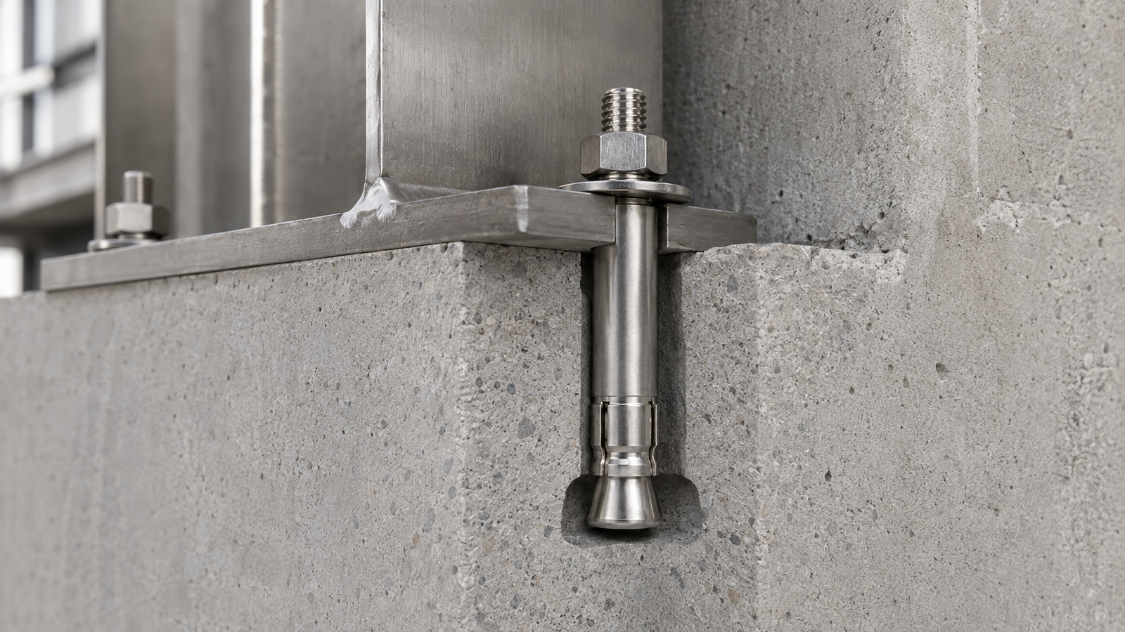Stainless steel mechanical undercut anchor fixing a structural steel bracket to concrete